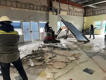 Technician removing wet flooring during a structural dry-out