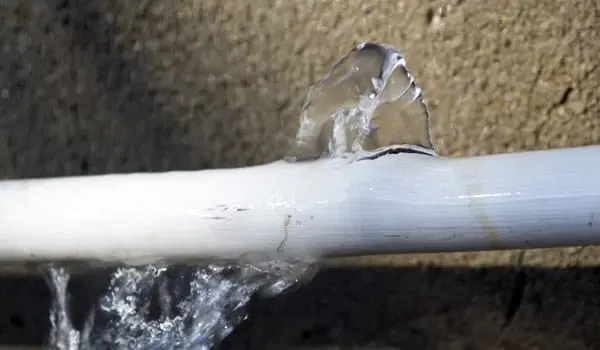 Water spurting from a failed appliance supply line in a Bay Shore home